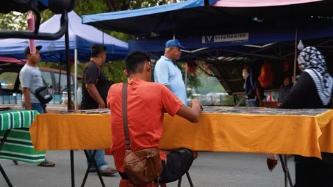 Crowd of Asian people at evening street market or Pasar malam Stock Footage 93817543