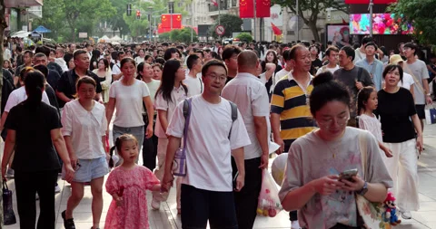 Crowd of asian people walking down a Nanjin street in Shanghai Stock Footage 327648759