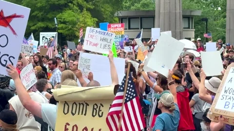 Crowd assembled at the Kings Protest, hundreds of people gathered closely Stock Footage 317529255