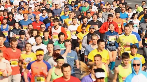 Crowd of athletes running at the marathon Stock Footage 108360714