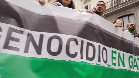 Crowd with banner protesting against the Palestinian genocide in Gaza 스톡 동영상 254367041
