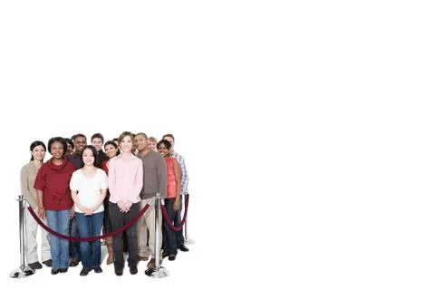 A crowd behind a barrier Stock Photos