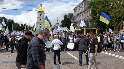 The crowd is being built into a column for the move, parade, march, procession. Stock Footage 134629702