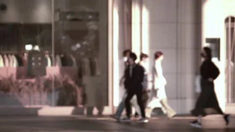 Crowd of blurred, unrecognizable people walking at street, Slow motion. Stock Footage 164859755