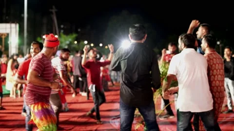 Crowd of boys dancing during the Garba function Video stock 231429660