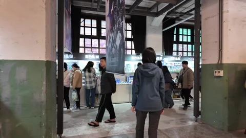 Crowd browsing merchandise at indoor anime convention in Taipei Stock Footage 345998995