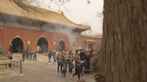 Crowd Burning Incense and Gathering at Traditional Temple Courtyard in Beijing Stock Footage 345684654
