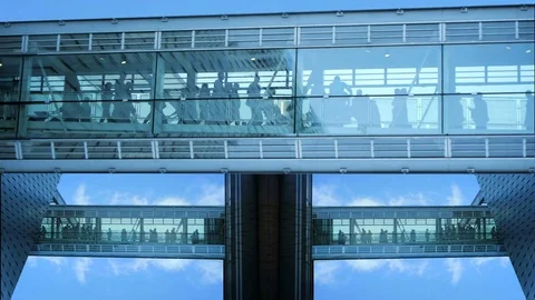 Crowd of business people commuting in futuristic glass building  Video stock 72863653
