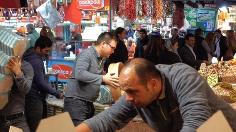 A crowd of buyers and sellers in the eastern bazaar. Sellers are preparing a  Stock Footage 87916341