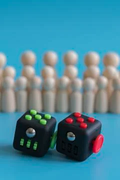 Crowd calm concept. answer how to calm the crowd. Cube stress reliever and wo Stock Photos
