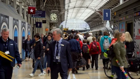 Crowd of Caucasian Commuters Walking To Train inside Large Railway Station Video stock 112329531