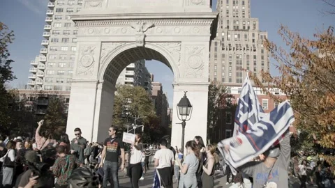 Crowd celebrating with flags and sig for2020 presidential election Stock Footage 142724082