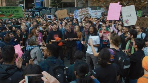 Crowd chanting for for climate action, holding signs. Vancouver, Sept 2019. Stock Footage 117978091