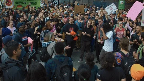 Crowd chanting for for climate action, holding signs. Vancouver, Sept 2019. Video stock 117978721