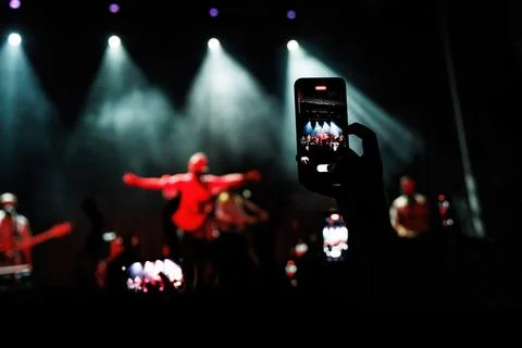 Crowd Cheering and Dancing at a Live Music Concert Stock Photos