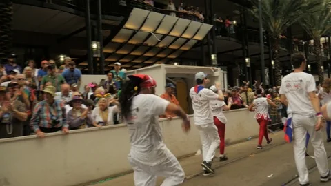 Crowd cheering clapping for Cuban Carnival dancers New Orleans Mardi gras parade Stock Footage 85322313