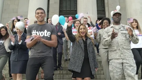 A crowd clapping and applauding while walking down stairs 動画素材 76235778