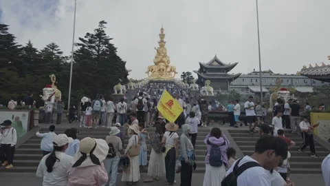 Crowd Climbing Steps Toward Golden Statue Видео 331125071
