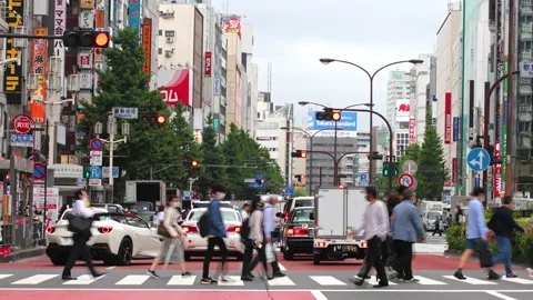Crowd of commuter and workers crossing street at zebra crosswalk during evening Stock-Footage 187739676