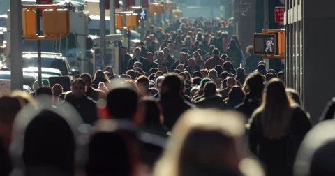 Crowd of commuter people walking on New York City street 4k slow motion backlit Stock Footage