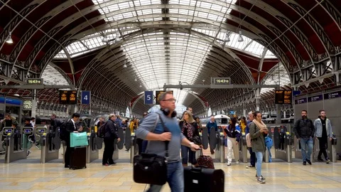 Crowd of Commuters Passing Through Automated Ticket Gates at Busy Train Station Video stock 112330267