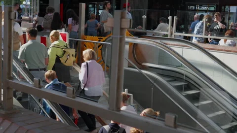 Crowd of commuters riding escalators at a public transport station in Hamburg Stock Footage 346142845