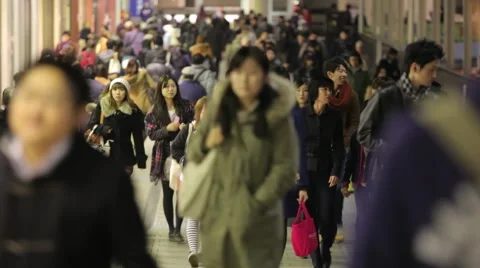 CROWD OF COMMUTERS WALKING DURING RUSH HOUR TOKYO JAPAN Stock Footage 59922310