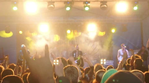 The crowd at a concert and having fun jumping Видео 40433035