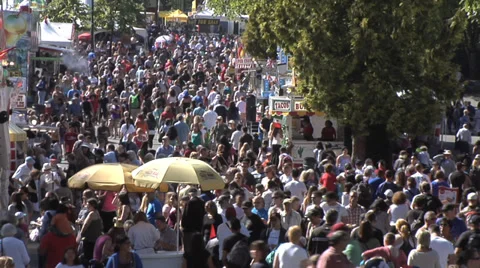 Crowd at country fair, time lapse medium, walking on midway. Evening MS Stock Footage 27550191