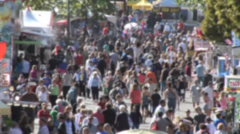 Crowd at county fair walking up Midway, soft focus Medium shot. Stock Footage 27551211