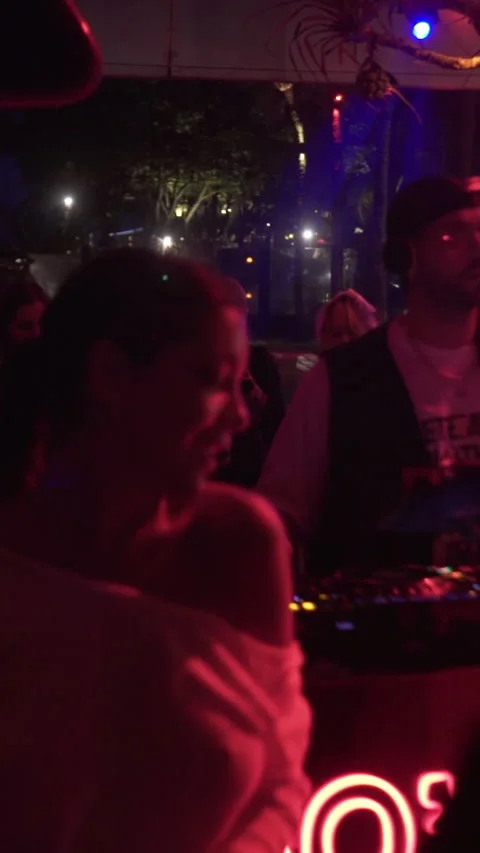 Crowd Dancing Around Live DJ at Tropical Beach Club Night Party. Stock Footage 337902899