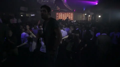 Crowd  dancing in a disco incited by vocalist - nightclub - discotheque Stock Footage 24707679