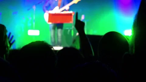 Crowd dancing during a concert with strobe lights from the stage Stock Footage 71813094