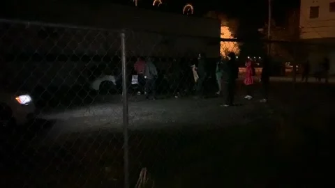 Crowd in the dark push a car amid the violent tension and riots in USA Video stock 137553515