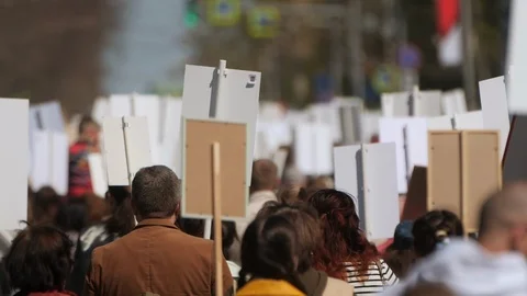 A crowd of demonstrators walking agitating on strike against the government. Stock Footage 121219784