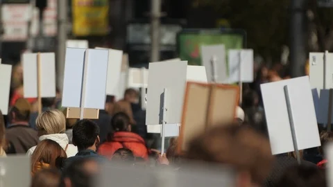 A crowd of demonstrators walking agitating on strike against the government. Stock Footage 121280084