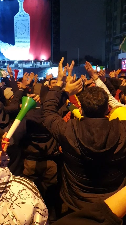 Crowd doing icelandic chant celebration at valiasr square tehran 스톡 동영상 336638825