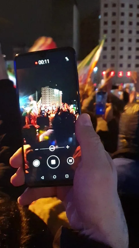 Crowd doing icelandic viking clap with flags and horns at valiasr square 스톡 동영상 336639520