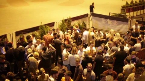 Crowd drinking young people above club nightlife smokers bar pub club Vídeos de archivo 96419211