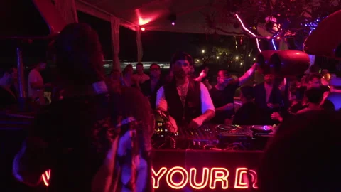 Crowd Enjoying Live DJ Performance at Beach Club Night Party in Bali, Indonesia Stock Footage 337902871