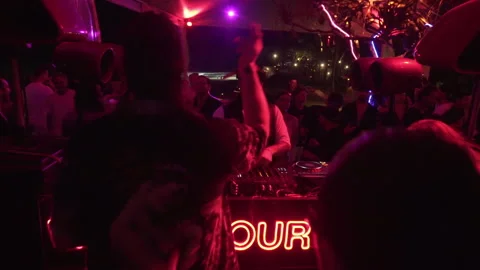 Crowd Enjoying Live DJ Performance at Beach Club Night Party in Bali, Indonesia Stock Footage 337902872