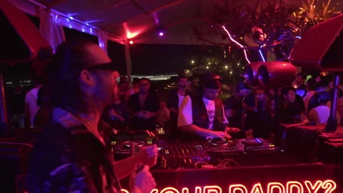 Crowd Enjoying Live DJ Performance at Beach Club Night Party in Bali Stock Footage 337902873