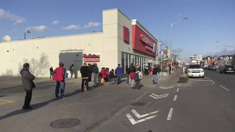 Crowd of eople line up at pharmacy for COVID 19 vaccine shot in Toronto 스톡 동영상 150341312