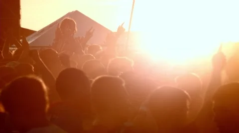 Crowd of fans on music festival. Sunset Stock Footage