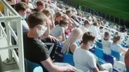 A Crowd Of Fans Sitting In The Stadium In Medical Masks And Watching A Match Stock Footage