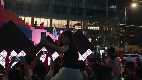Crowd Filming Squid Game Parade Float in Seoul Stock Footage 312741374
