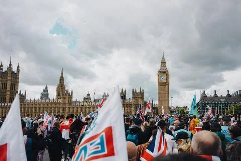 Crowd with Flags at Free Speech Protest Outside Houses of Parliament and Bi.. Stock Photos