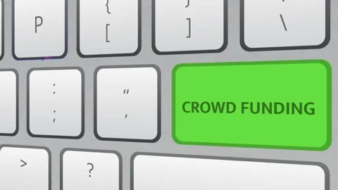 Crowd Funding green key button being clicked on white keyboard. Stock Footage 221332572