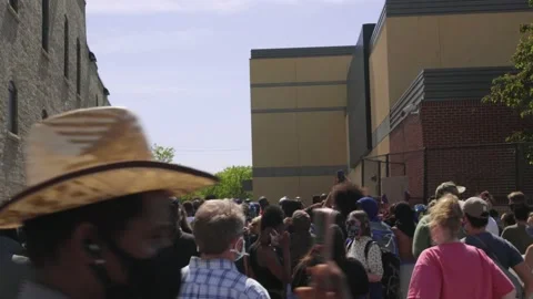 A crowd gathered outside Minneapolis 3rd precinct police station. George Floyd. Stock Footage 158776142