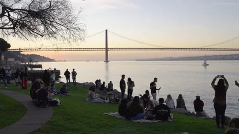 Crowd gathered for picnics in Cacilhas, Almada in Lisbon, Portugal Stock Footage 266434536